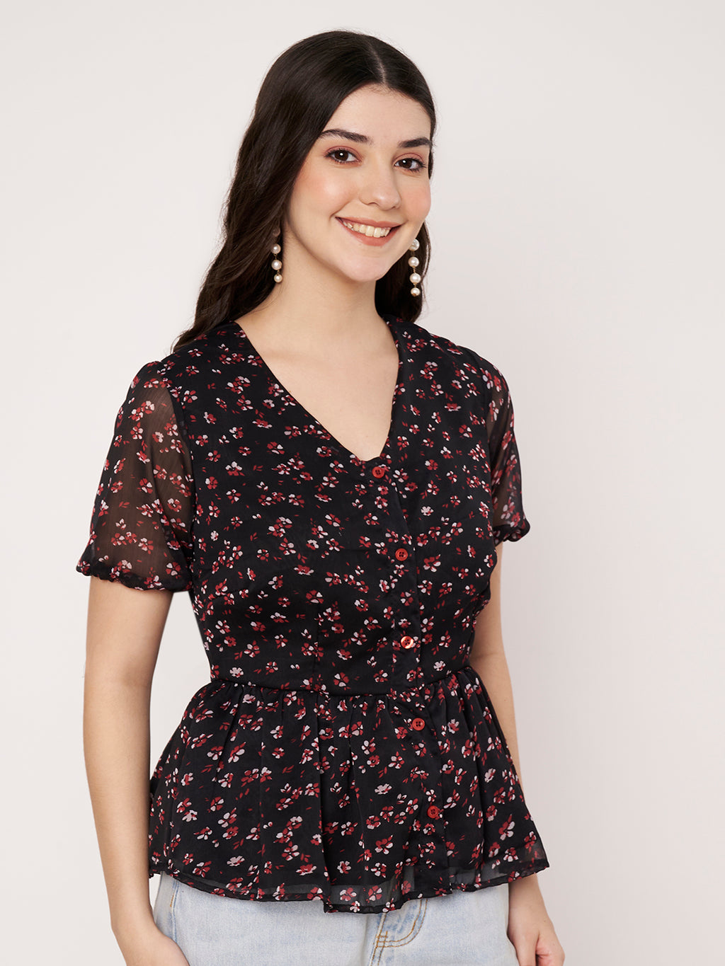Short-sleeve black top with red and white ditsy floral print.