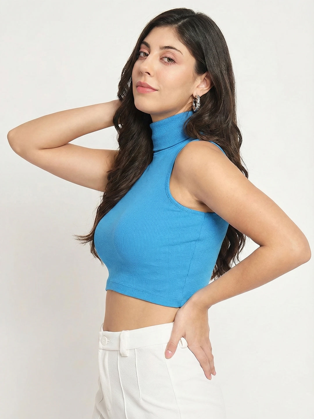 Side view of fitted blue sleeveless crop top