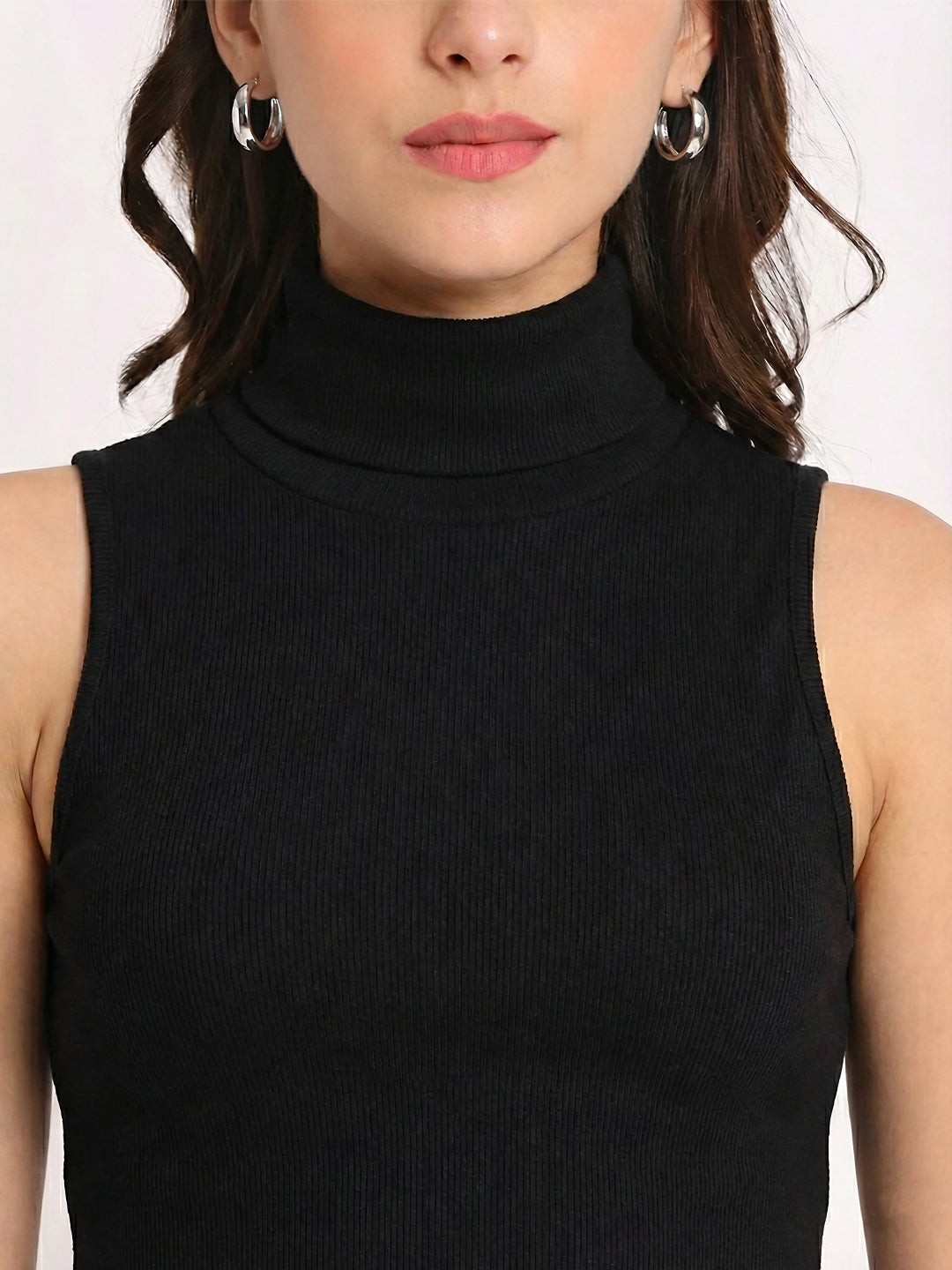 Front view of black high neck sleeveless crop top