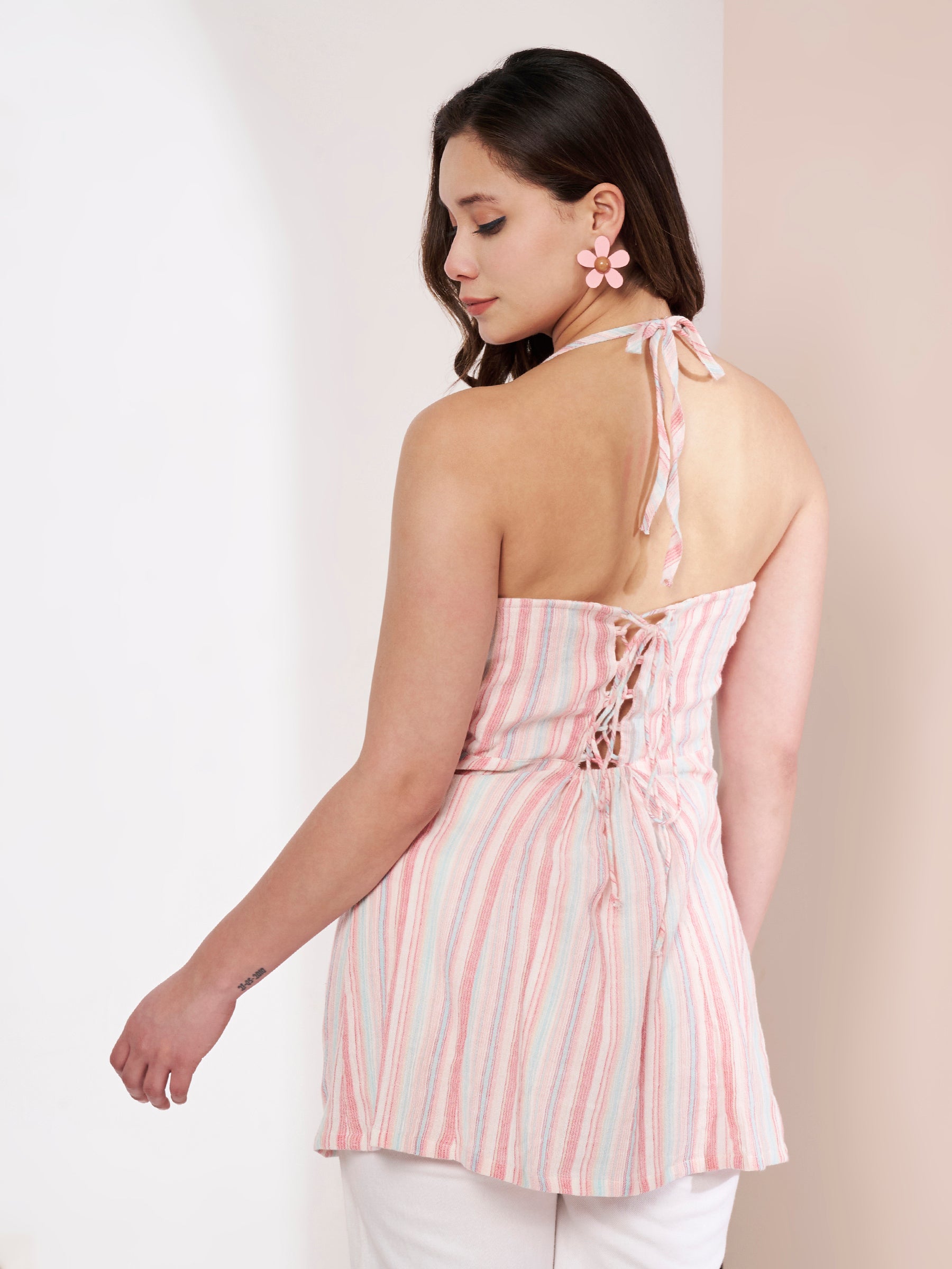 Back view of a striped kurti featuring a corset-style lace-up design