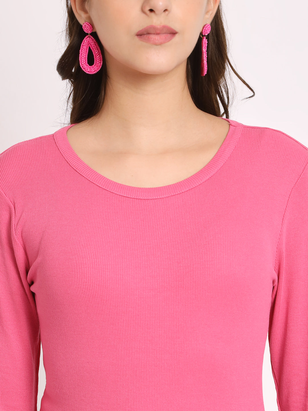 Close-up of ribbed fabric texture in pink top
